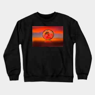 Glass globe on sunset background Crewneck Sweatshirt